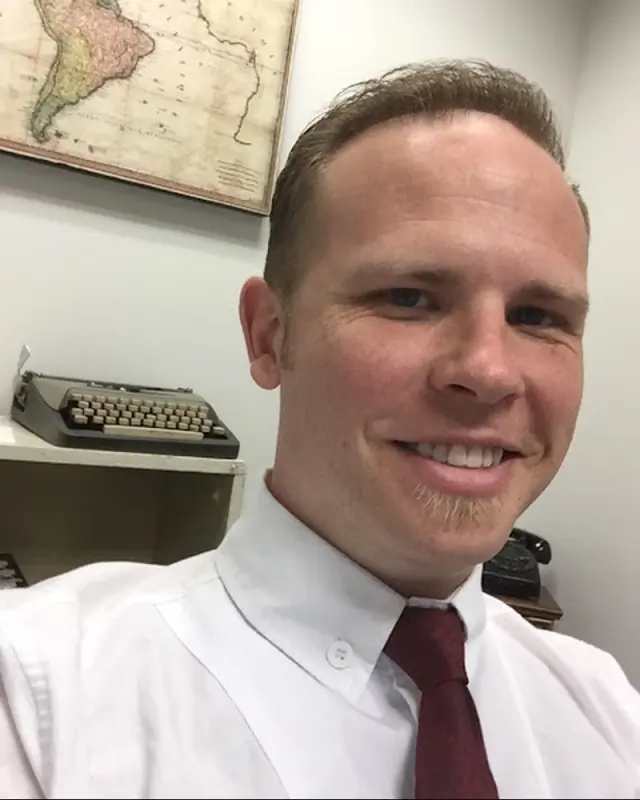 Martin Tippet, licensed agent with ExecuHome Realty, in formal office attire