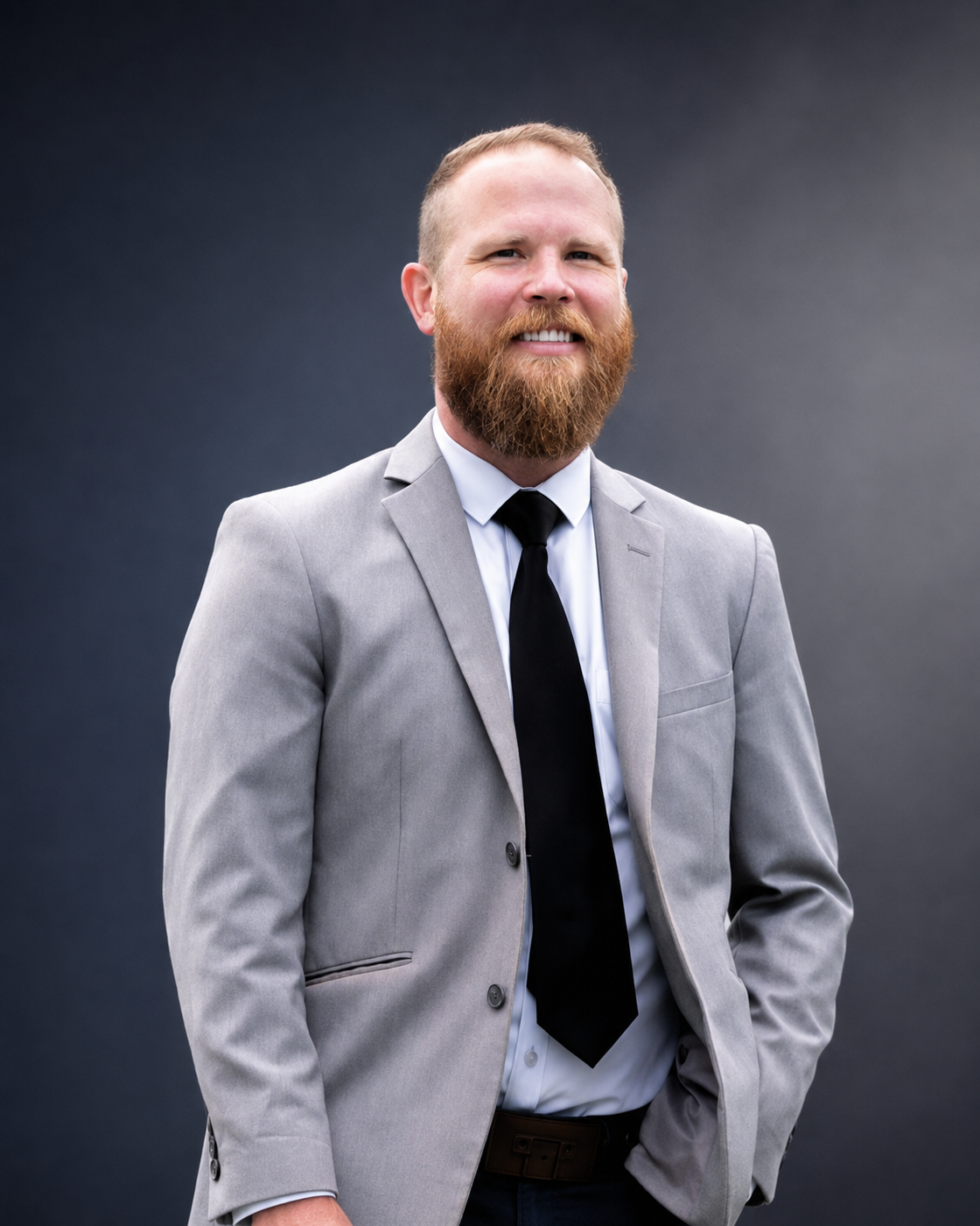 Martin Tippet in a gray suit jacket